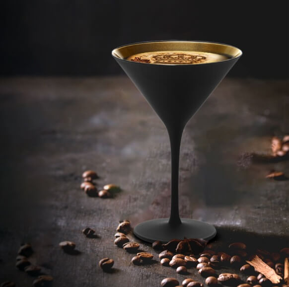 Crème De La Crown cocktail in a glass decorated with coffee beans
