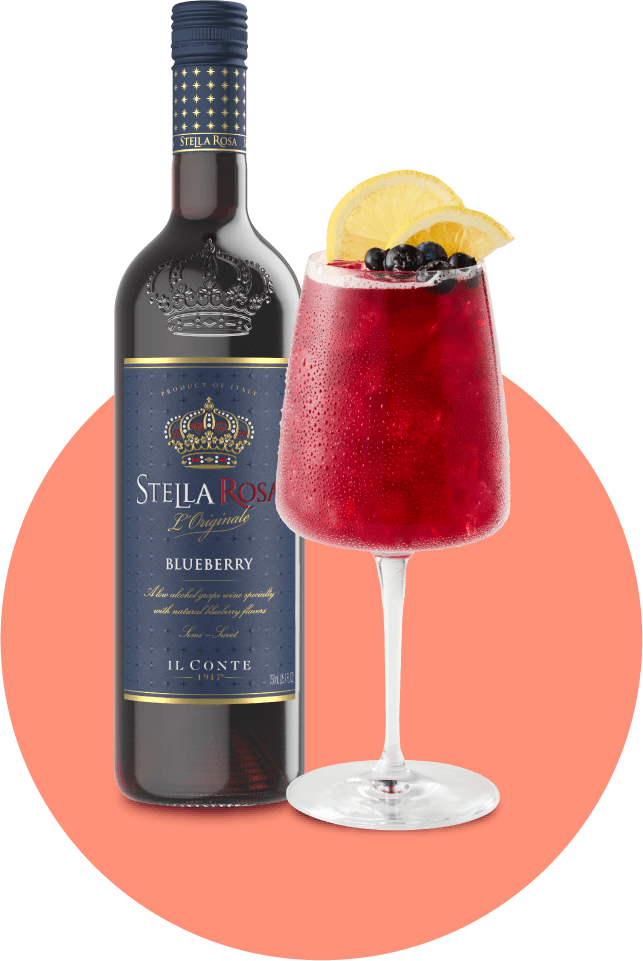 Stella Rosa Blueberry® bottle and Ladies First Cocktail garnished with a lemon slice